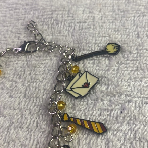 # 31 Charming Silver Bracelet with Red and Yellow Metal Charms - Picture 6 of 7